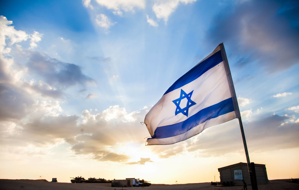 Israeli flag over desert