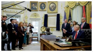 DJT in oval office with reporters