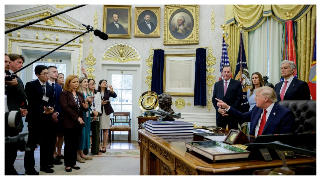 DJT in oval office with reporters